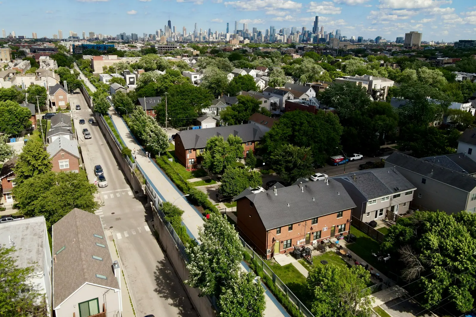 Chicago neighborhood rooftops with the skyline in the distance