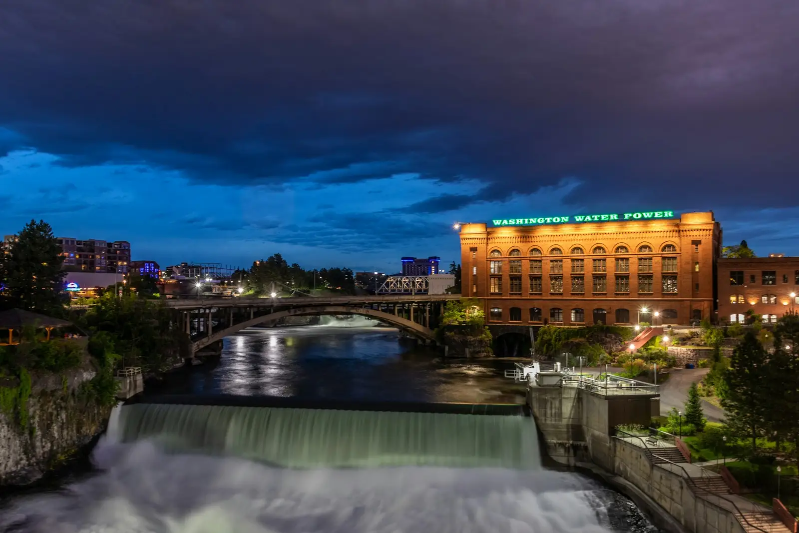 Spokane River falls and downtown at dusk