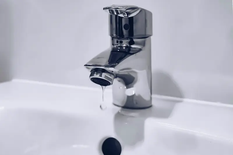 Water running from a chrome faucet