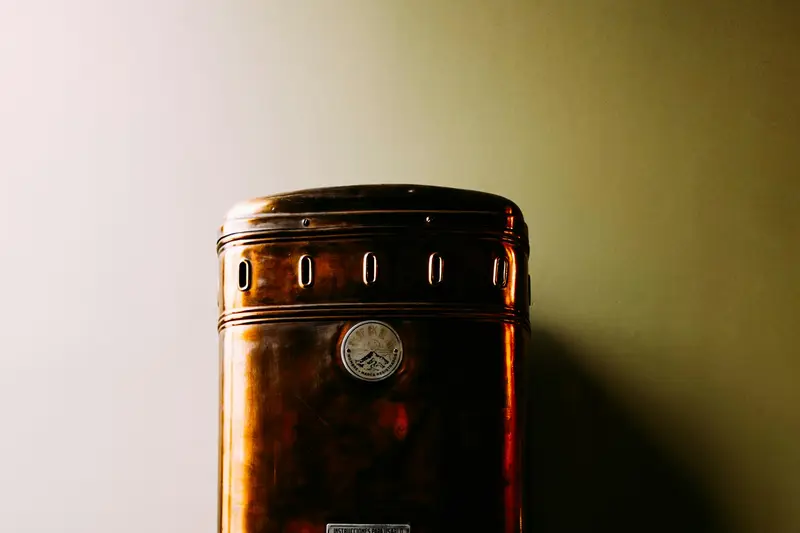 Old copper water heater on a wall