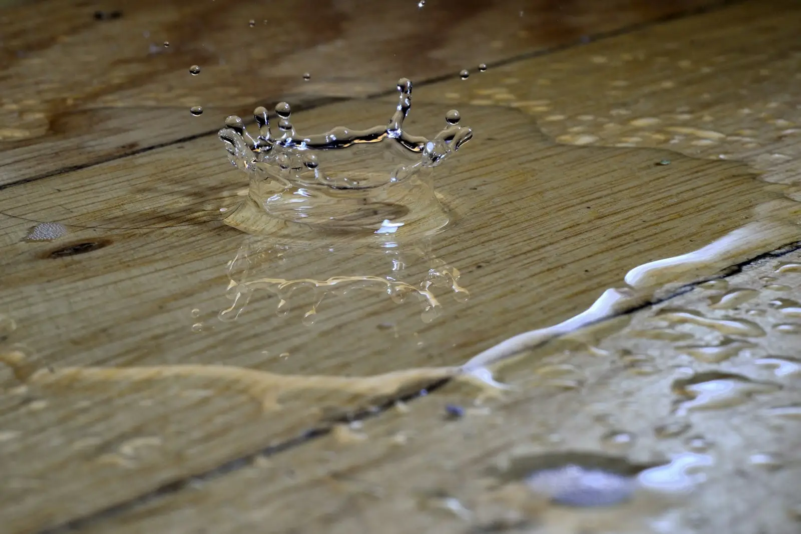Water splashing on a wooden floor